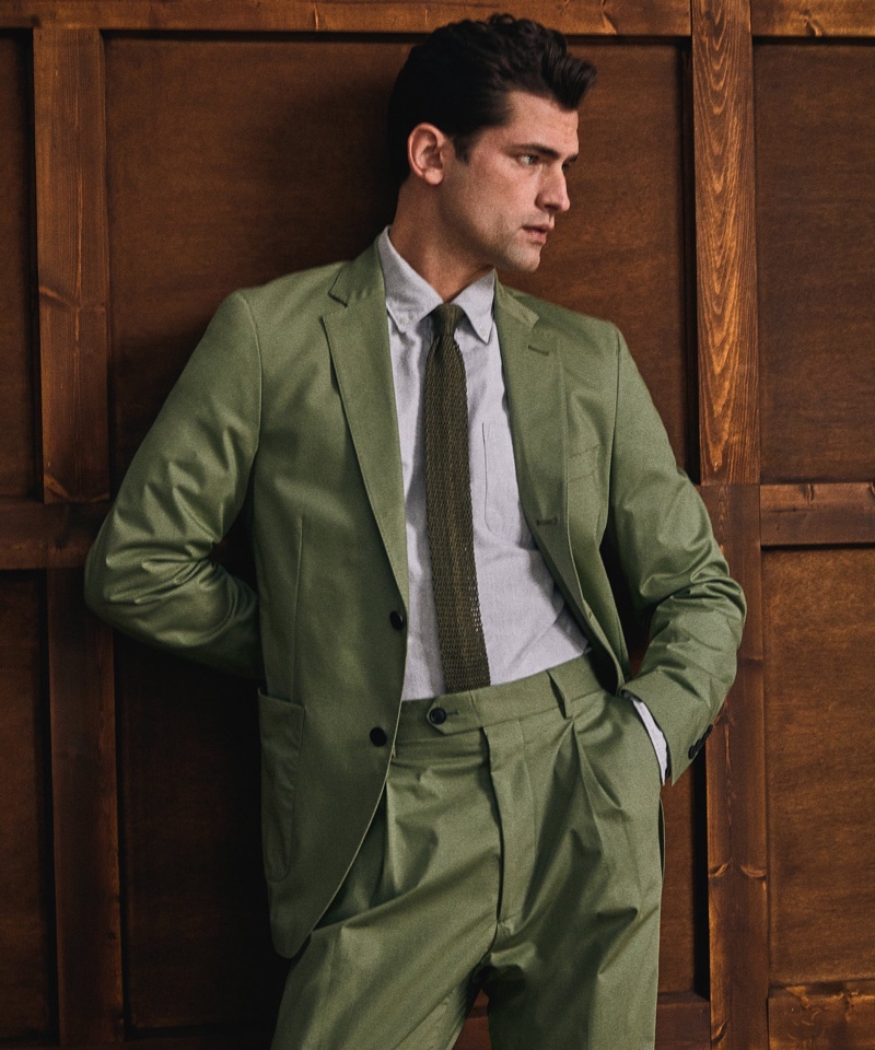 Sean O'Pry steals the spotlight in a smart Italian stretch twill Madison suit in faded olive from Todd Snyder.