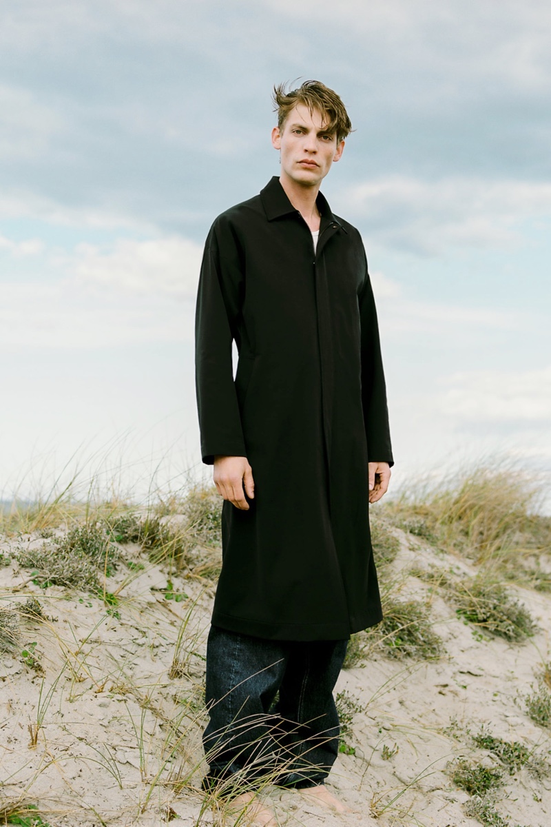 A sleek vision, Baptiste Radufe embraces clean lines in a relaxed coat and baggy jeans from Zara.