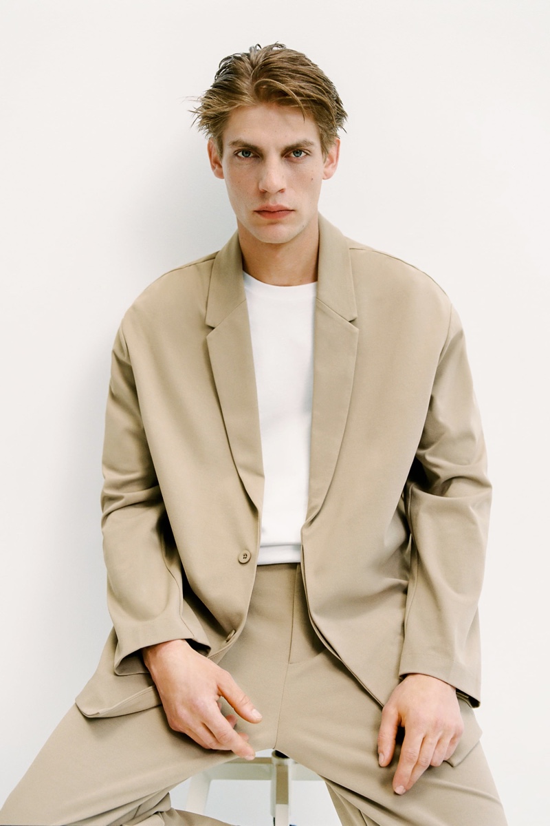Relaxed tailoring is front and center as Baptiste Radufe wears a tan suit from Zara Man.
