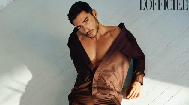 Summer House Star Andrea Denver is 'Grounded' for L'Officiel Baltics Making a statement in brown, Andrea Denver wears a Valentino jumpsuit with Saint Laurent boots for L'Officiel Baltics.
