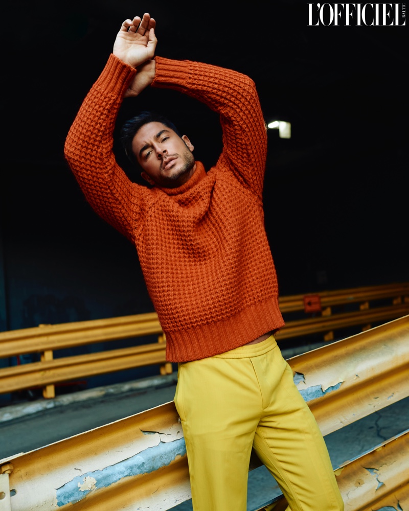 Embracing a bright pop of color, Andrea Denver rocks a Dolce & Gabbana sweater with Valentino pants for L'Officiel Baltics.