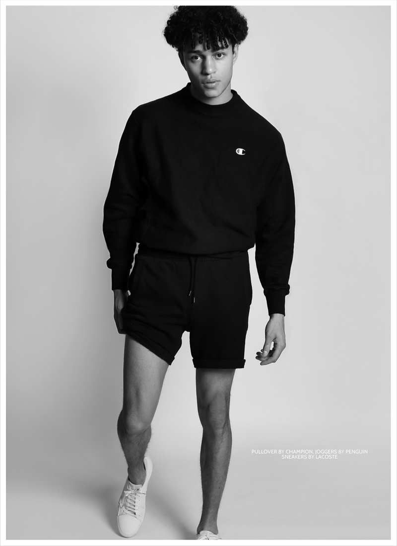 Callum wears pullover Champion, shorts Penguin, and sneakers Lacoste.