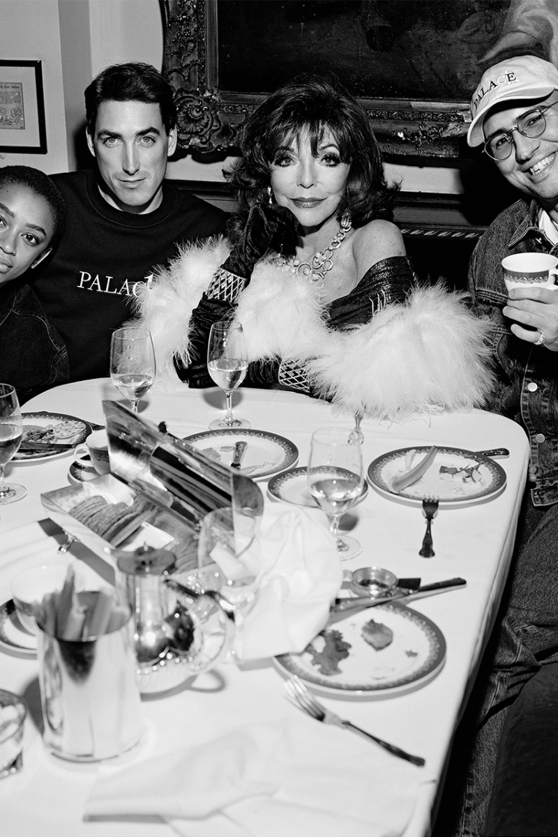 Savannah Keenan, Rory Milanes, and Lev Tanju share a meal with Joan Collins for the Calvin Klein Palace CK1 Campaign.