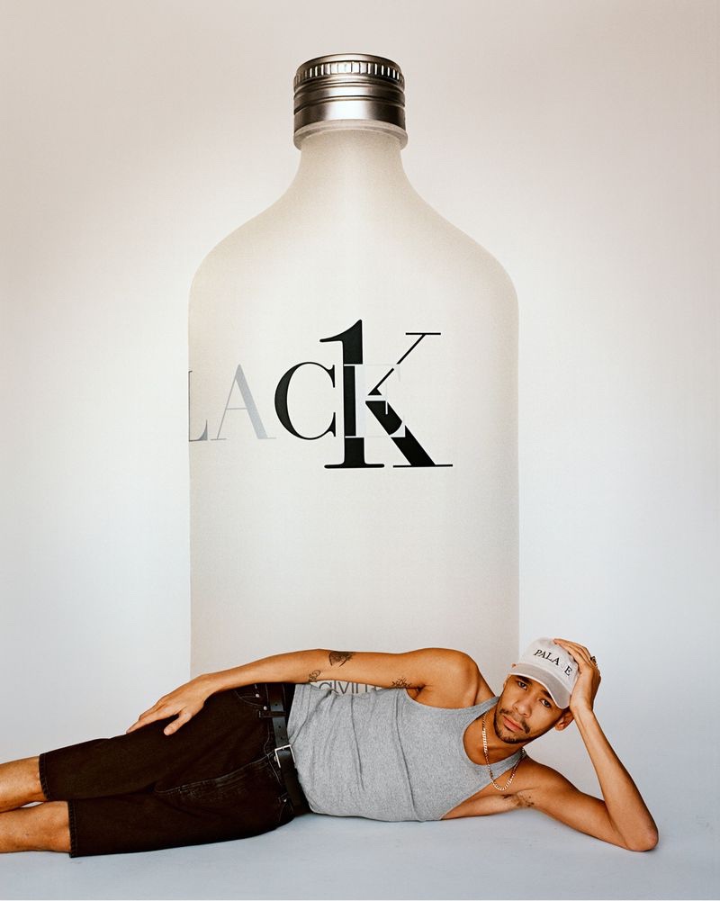 Posing in front of an oversized bottle of Palace CK1, Lucien Clarke stars in the Calvin Klein Palace campaign.