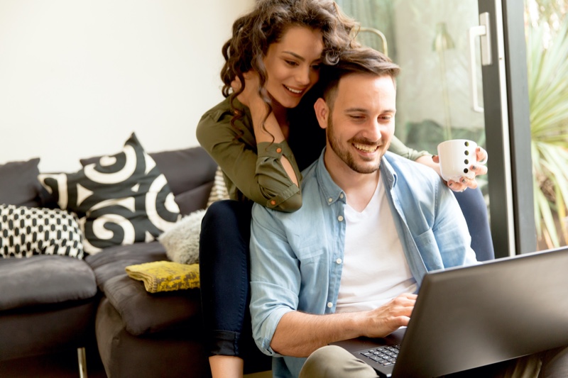 Couple Looking Online for Something Laptop