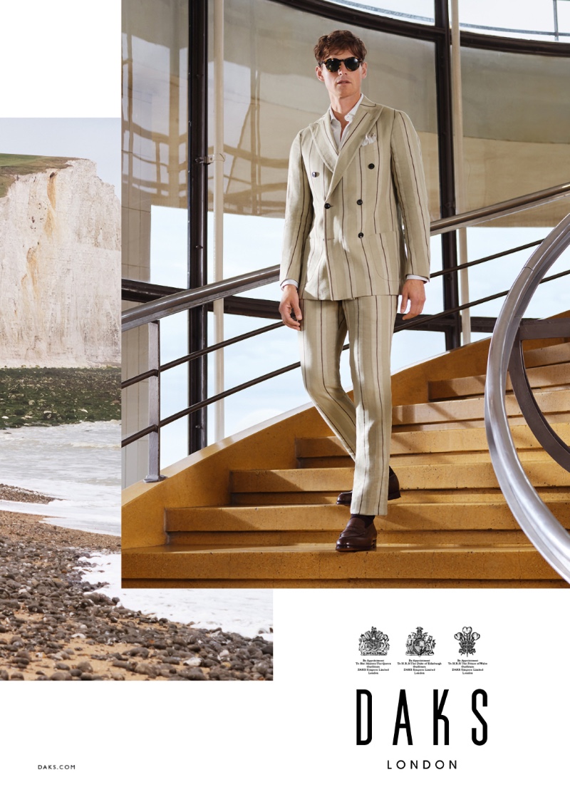 Donning a striped double-breasted linen suit, Guy Robinson stars in Daks London's spring-summer 2022 campaign.