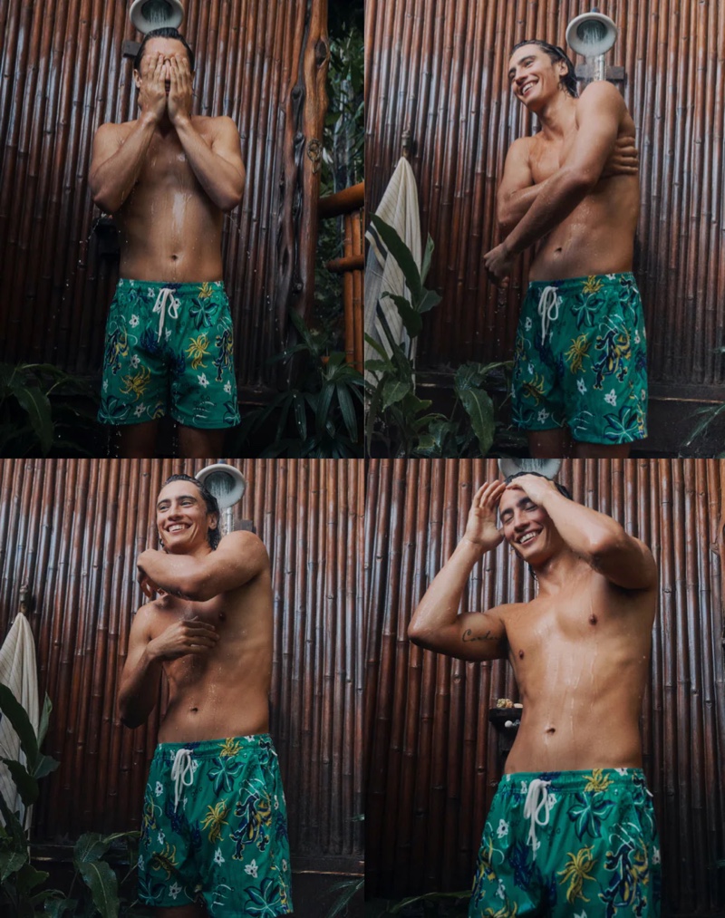 James Turlington washes off in a pair of J.Crew's 6" stretch swim trunks in a "Under the Sea" green.