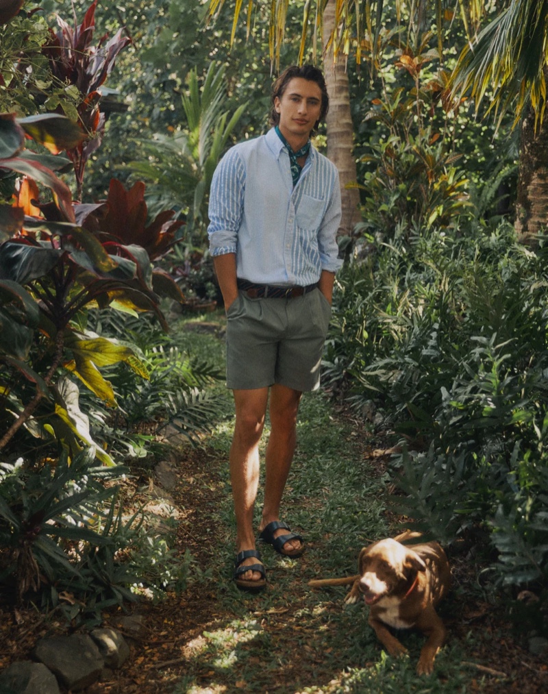 In front and center, James Turlington sports a J.Crew organic cotton seersucker striped shirt with 7.5" pleated chino shorts, a D-ring webbed belt, a Wallace & Barnes bandana, and Birkenstock Arizona sandals.