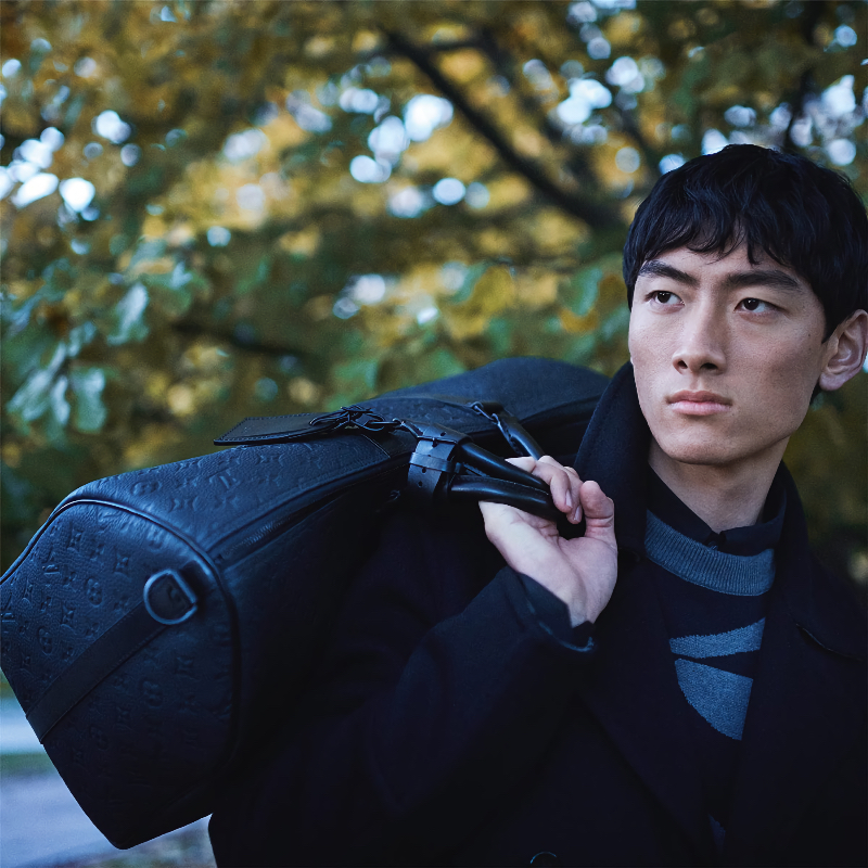 David Ge takes hold of one of Louis Vuitton's beloved keepalls for the brand's latest ad campaign.