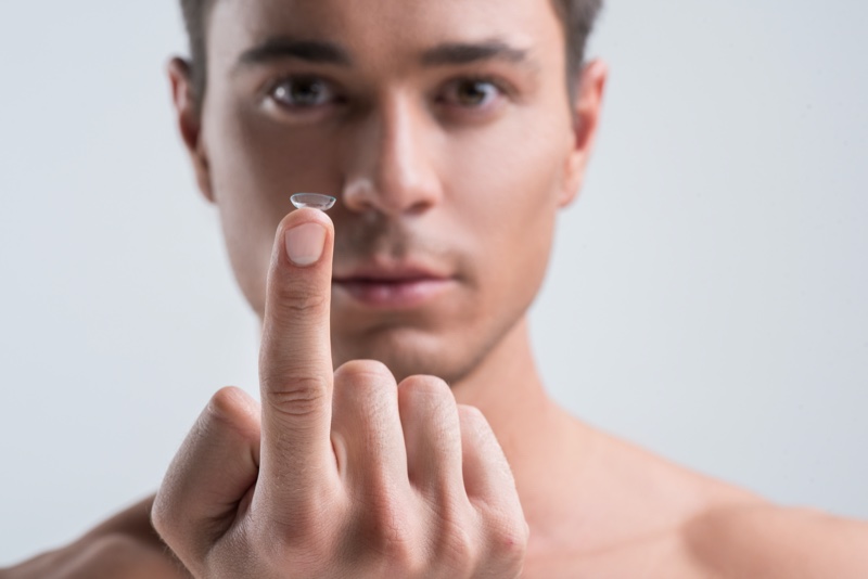 Male Holding Contact Lens Finger