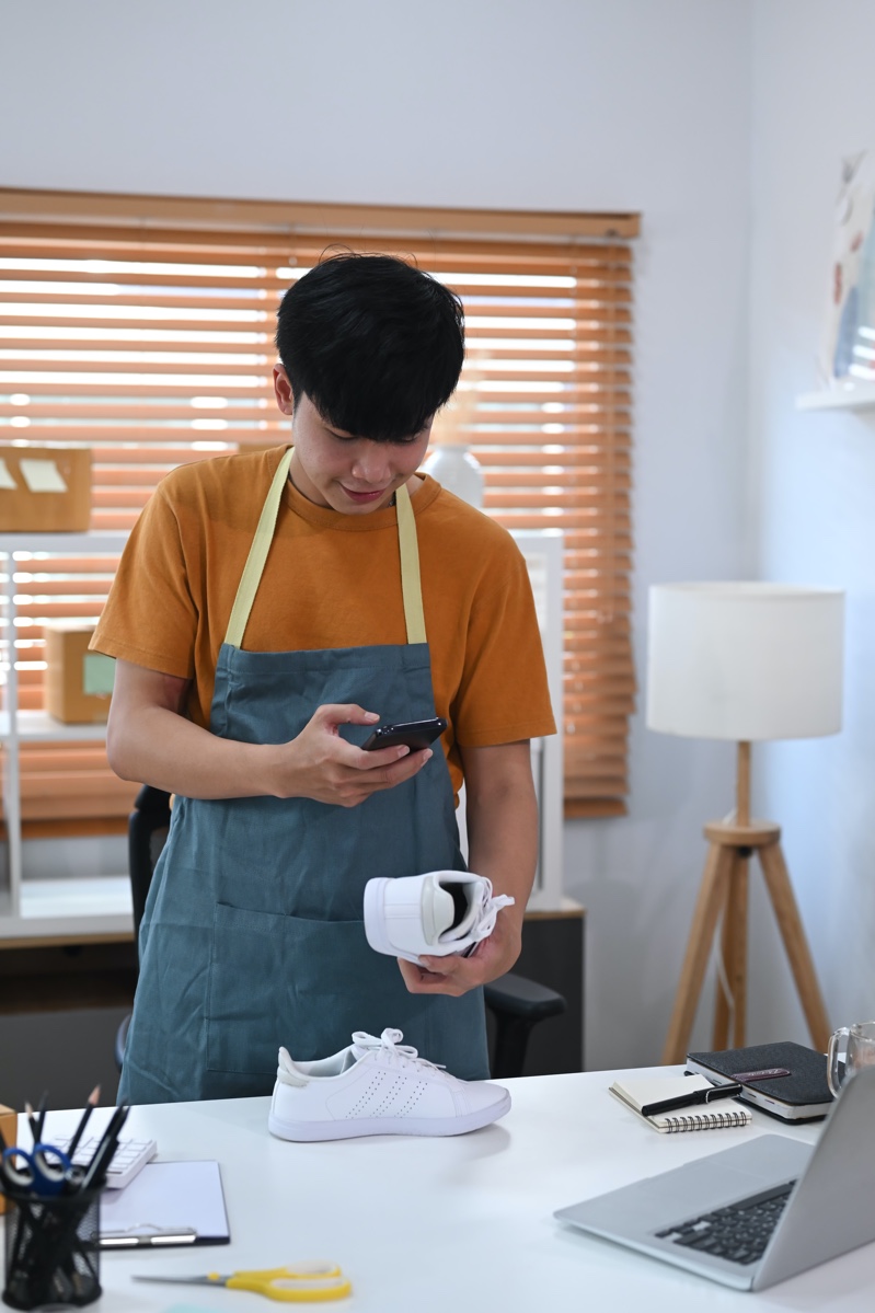 Man Taking Photo of Shoes to Sell Online