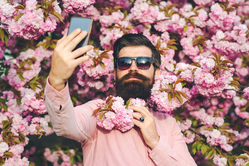 Man Wearing Pink Shirt Taking Selfie
