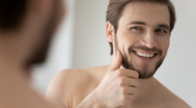 Do White Teeth Make You More Attractive? Man with White Teeth Mirror