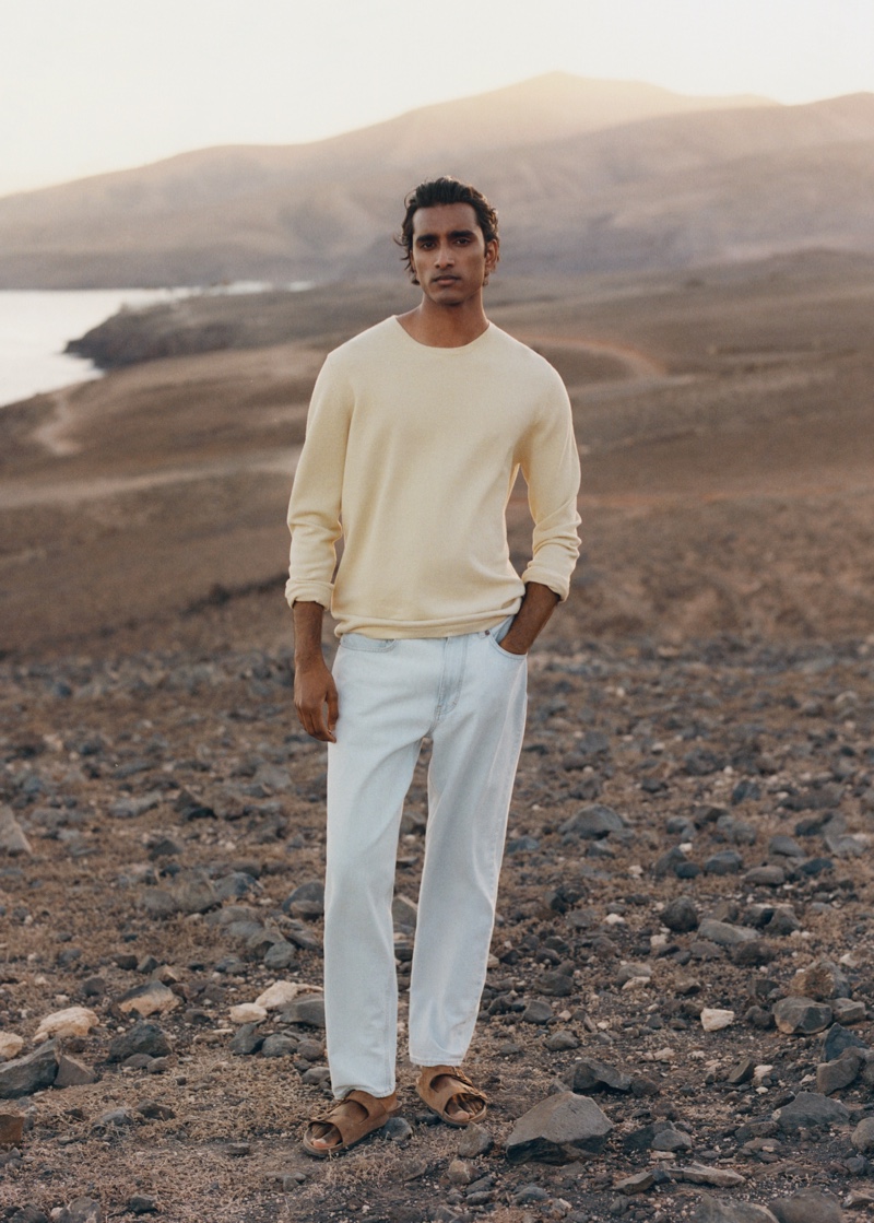 Jeenu Mahadevan is a chic vision in a sweater and light wash jeans from Mango Man.