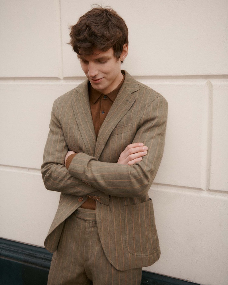 A smart vision, Callum Ward sports a pinstripe suit with a polo from Paoloni.