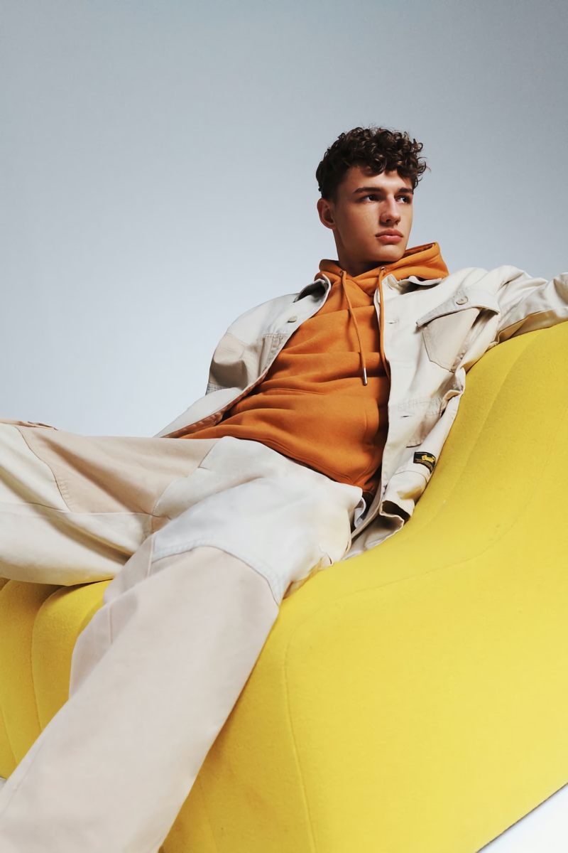 Ondrej Mokoš wears a relaxed CO-ORD look with an orange hoodie from Pull & Bear.