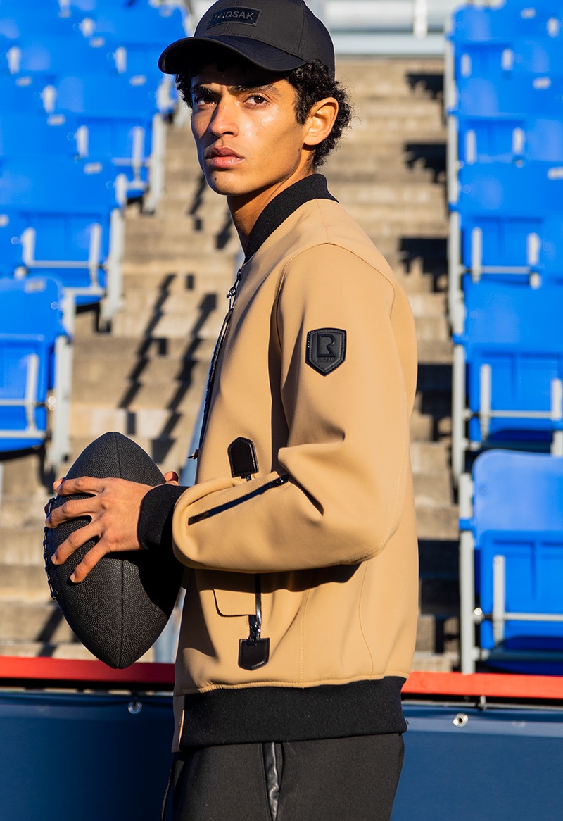 Ready for a game of football, Yahia Battawy wears RUDSAK's Julien neoprene bomber jacket.