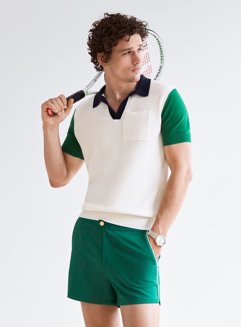 Ready for a game of tennis, Simon Nessman sports a tennis knit polo with green shorts from Simons.