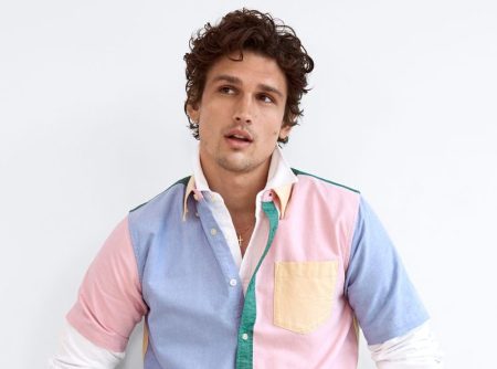 A preppy vision, Simon Nessman models a LE 31 multi-colored oxford shirt with denim jeans from Simons.