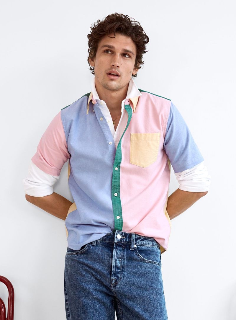 A preppy vision, Simon Nessman models a LE 31 multi-colored oxford shirt with denim jeans from Simons.