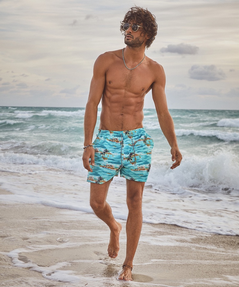Brazilian model Marlon Teixeira sports 5" Montauk swim shorts from Todd Snyder with Randolph Skytec glass polarized sunglasses.