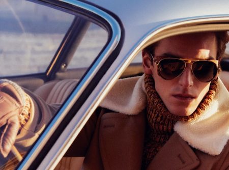 Embracing brown, model Quentin Demeester dons a fall-winter 2022 look from Tod's.