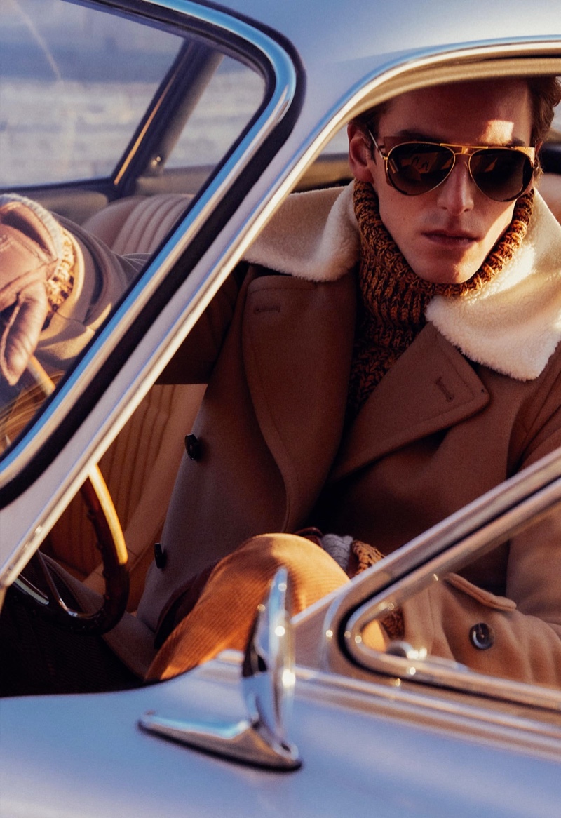 Embracing brown, model Quentin Demeester dons a fall-winter 2022 look from Tod's.