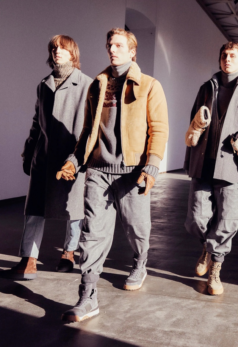 Warm layers and stylish boots come together for Tod's fall-winter 2022 collection modeled by Lucan Song, Quentin Demeester, and Henry Kitcher.