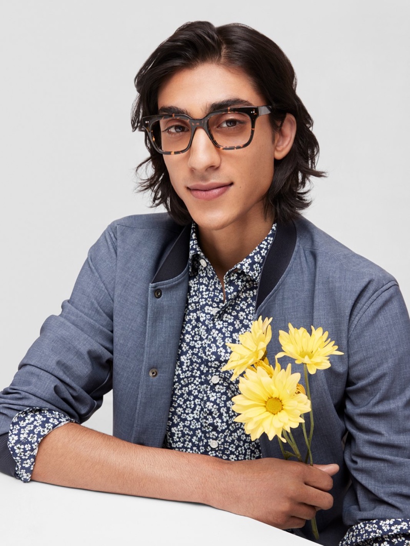 Adarsh Jaikarran charms in a pair of Warby Parker's Winston glasses in Black Oak Tortoise.