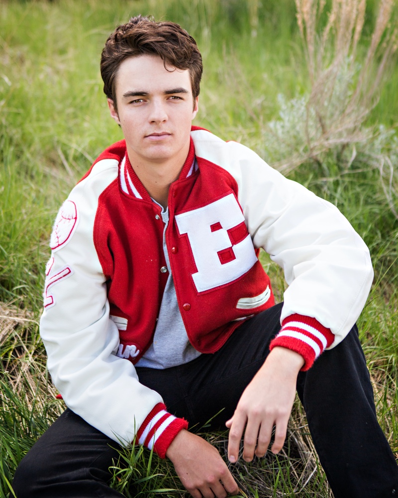 Young Man Wearing Varsity Jacket Red