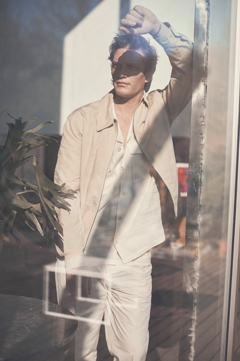 Embracing neutrals, Florian Van Bael models a Lemaire shirt jacket with a Nanushka shirt and pleated pants.