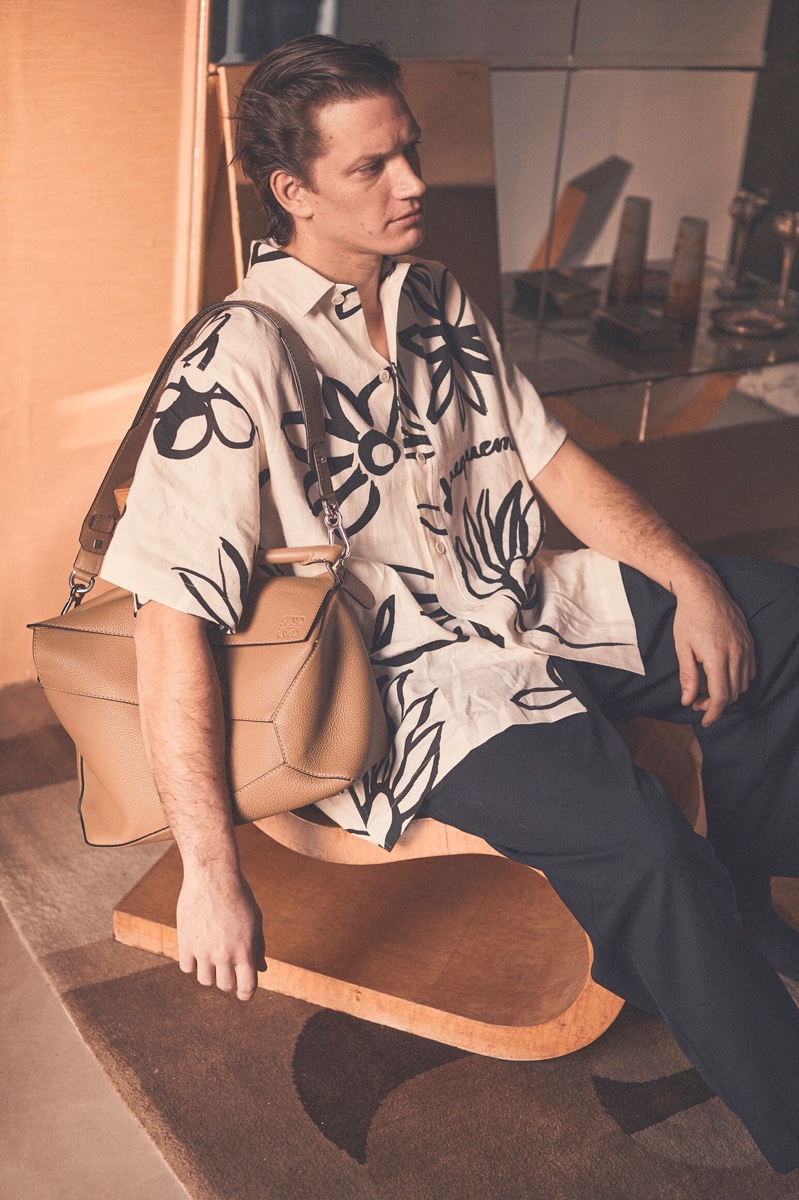 Making a graphic statement in white and black, Florian Van Bael dons a JACQUEMUS shirt from Luisaviaroma.