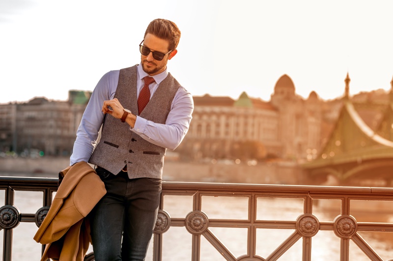 Man Checking Watch Vest Jeans Fashion Outfit