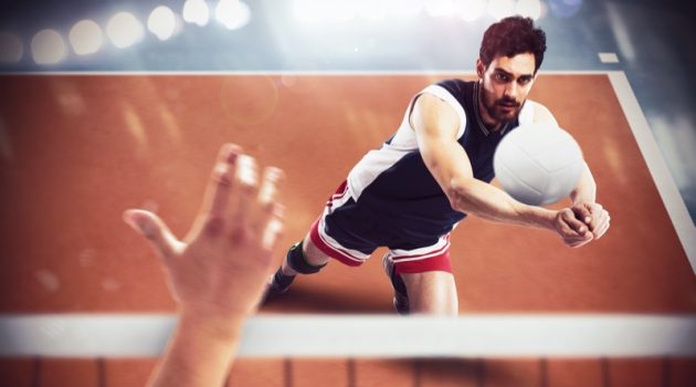Fitness Fashion: Helping You Look the Part on the Volleyball Court Man Playing Volleyball