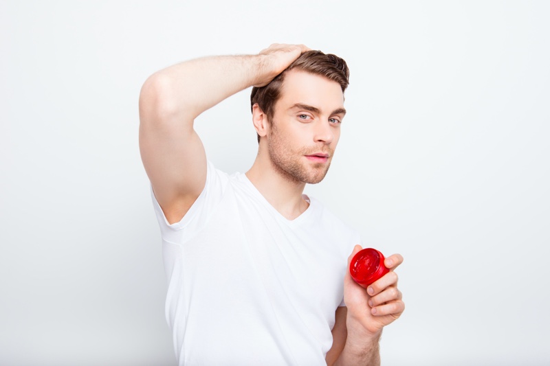 Man Putting Product in Hair