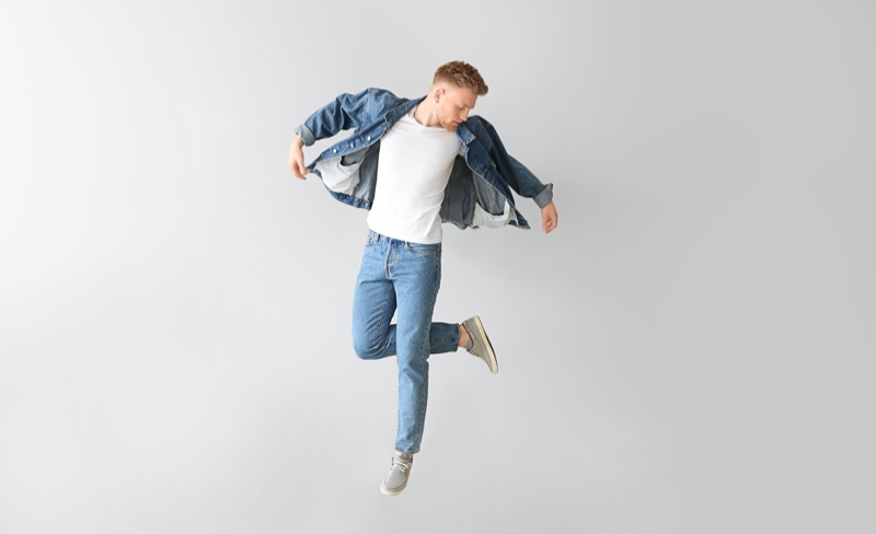 Model Jumping in Denim Jeans