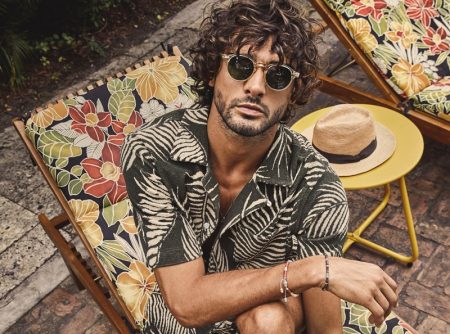 Marlon Teixeira embraces resort style in a matching Palm Leaf full placket terry polo and shorts from Todd Snyder.