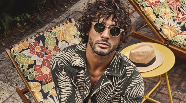 Marlon Teixeira embraces resort style in a matching Palm Leaf full placket terry polo and shorts from Todd Snyder.