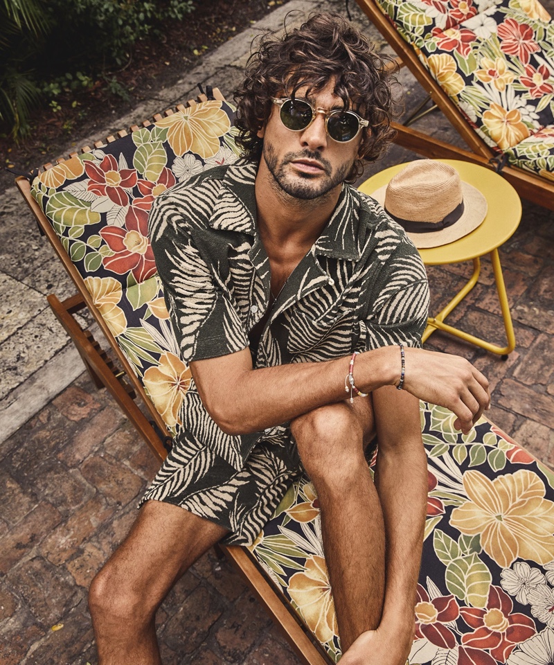 Marlon Teixeira embraces resort style in a matching Palm Leaf full placket terry polo and shorts from Todd Snyder.