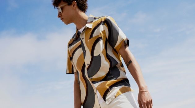 Jackson Hale Inspires in Summer Style from Mr P. Jackson Hale wears a Mr P. irregular wave printed organic cotton shirt with an organic cotton-jersey t-shirt, and slim-fit white denim jeans. He also rocks Mr P. + Cubitts Herbrand round-frame acetate sunglasses.