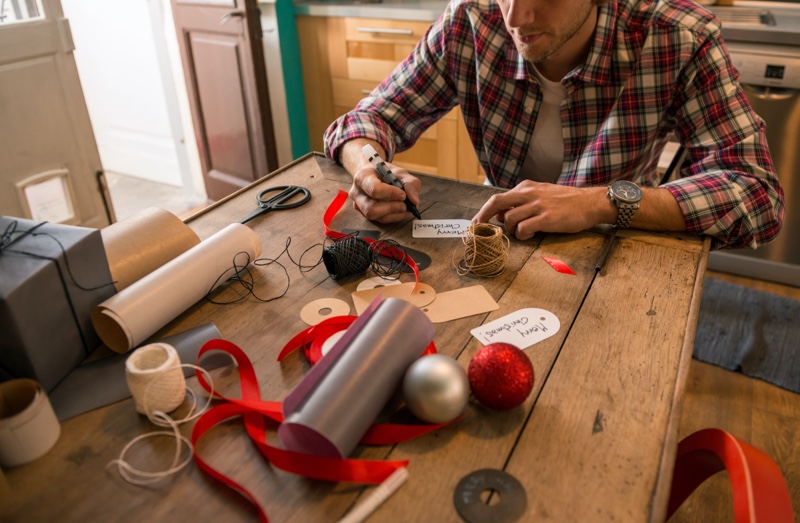 Man Wrapping Christmas Gifts