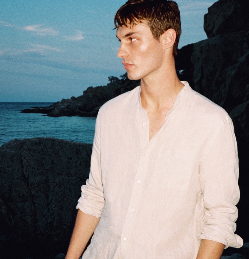 Donning Mango Man, Kit Butler wears a white linen grandad collar shirt. » Kit Butler Embraces a Mediterranean Summer with Mango Donning Mango Man, Kit Butler wears a white linen grandad collar shirt.