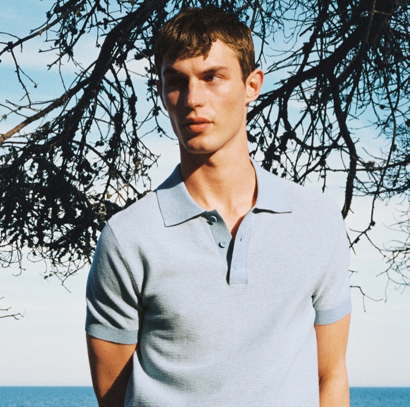 Embracing smart summer style, Kit Butler dons a woven polo shirt from Mango Man.