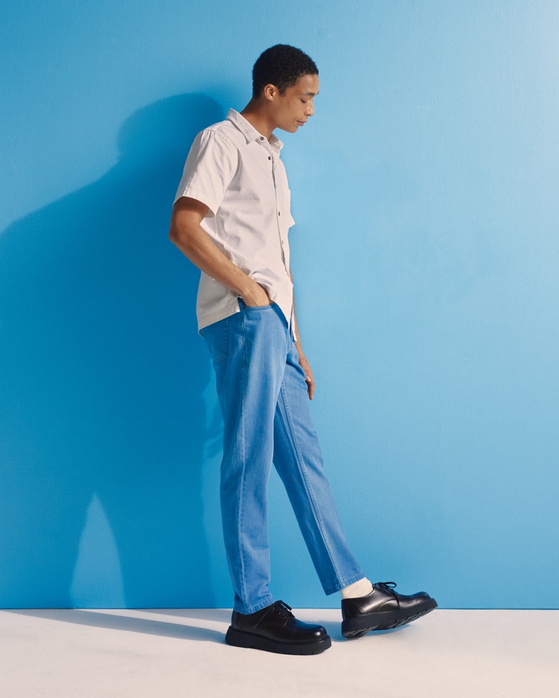 Standing tall at 6'1.5", Luke Cousins models Onia's summer shirt and denim pant.