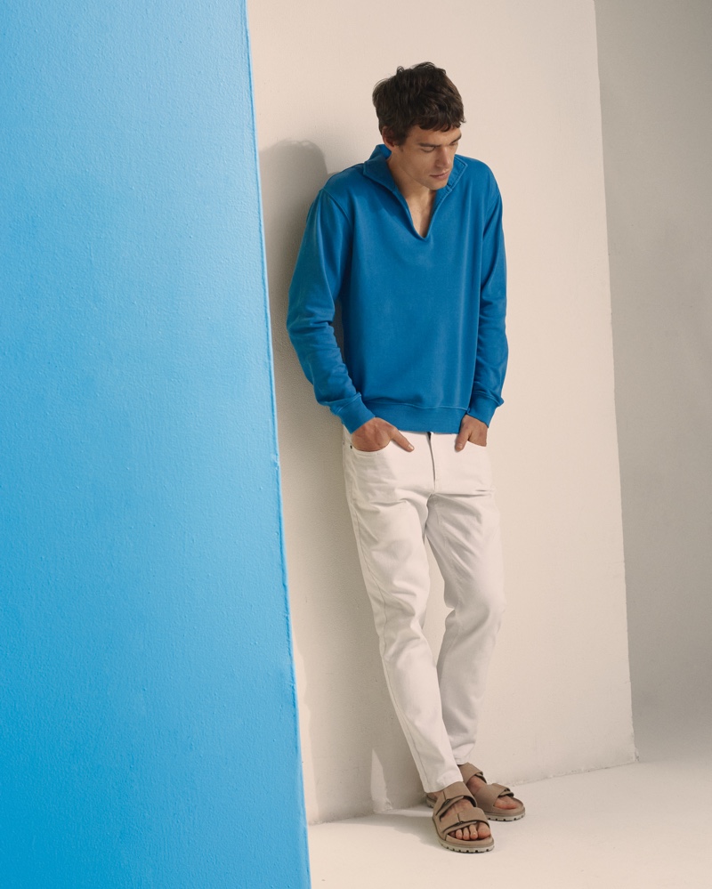 Philipp Schmidt wears Onia's garment dye terry pullover with white summer denim pants.