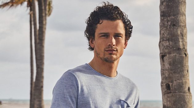 Simon Nessman Models Summer Linen, Tailoring + More from Todd Snyder Going casual in a summer essential, Simon Nessman sports Todd Snyder's linen Shore sweater in blue willow.