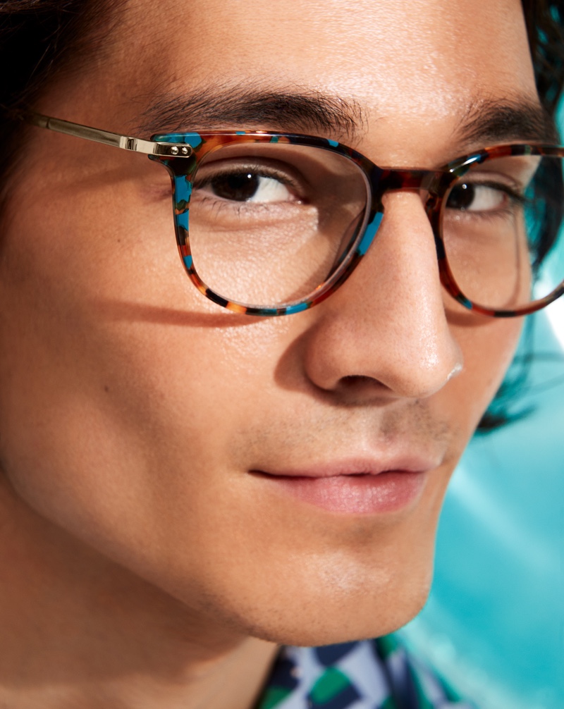 Sebastiao Hungerbuehler models Warby Parker's Kian glasses in Teal Tortoise with Polished Gold.