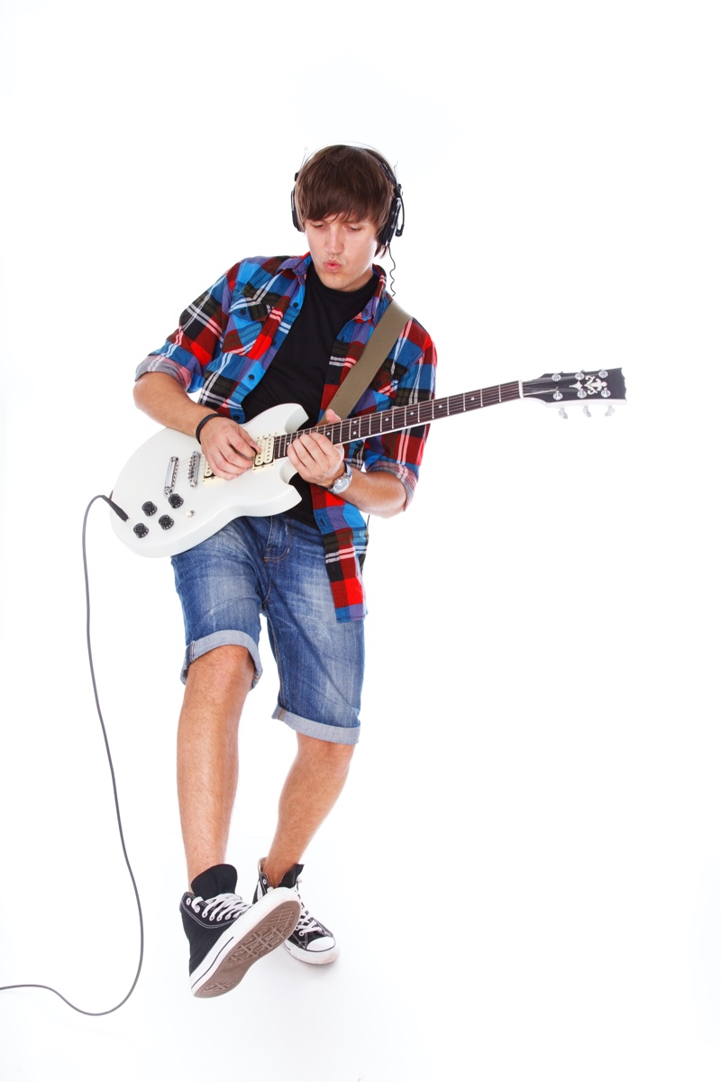 Young Man Plaid Shirt Denim Shorts Guitar Converse High Top Sneakers