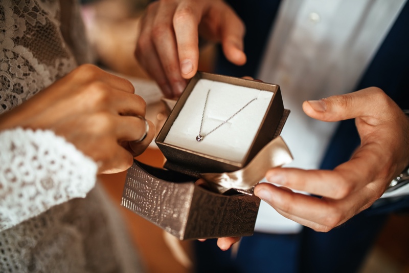 Man Gifting Jewelry Woman