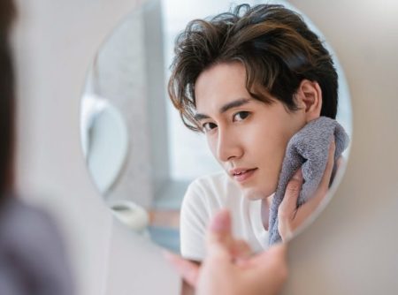 Asian Man Skincare Drying Face